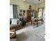 Bright living room featuring a cozy sofa, complemented by natural light and stylish decor at 411 Sherrels Frd, Peachtree City, GA 30269