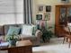Bright living room featuring a cozy sofa, complemented by natural light and stylish decor at 411 Sherrels Frd, Peachtree City, GA 30269