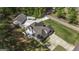 Aerial view showcasing home with spacious driveway, detached garage, and welcoming outdoor patio at 5133 Woodmond Dr, Villa Rica, GA 30180