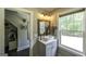 Stylish bathroom with a vessel sink, modern fixtures, and a view to the outdoors at 5133 Woodmond Dr, Villa Rica, GA 30180