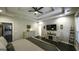 Spacious bedroom with tray ceiling, modern fan, and stylish furniture, offering a cozy retreat at 5133 Woodmond Dr, Villa Rica, GA 30180