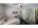 Charming bedroom with a comfortable bed and decorated with shelving at 5133 Woodmond Dr, Villa Rica, GA 30180