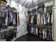 Spacious walk-in closet with ample storage and functional organization, perfect for the fashion-conscious at 5133 Woodmond Dr, Villa Rica, GA 30180