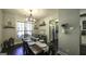 Inviting dining room featuring a wooden table, dark wood flooring, and stylish chandelier at 5133 Woodmond Dr, Villa Rica, GA 30180