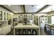 Open kitchen with a marble island, bar stool seating, and dark hardwood floors at 5133 Woodmond Dr, Villa Rica, GA 30180