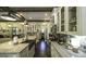 Long kitchen with white cabinets, a large island, and stainless appliances at 5133 Woodmond Dr, Villa Rica, GA 30180