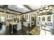 Bright kitchen featuring white cabinetry, marble countertops, and stainless steel appliances at 5133 Woodmond Dr, Villa Rica, GA 30180