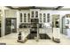 Kitchen island sink with marble countertops, stainless appliances, and tile backsplash at 5133 Woodmond Dr, Villa Rica, GA 30180