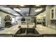 Farmhouse kitchen features a large island, custom cabinets, and stainless steel sink at 5133 Woodmond Dr, Villa Rica, GA 30180