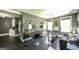 Open concept living room with many windows, gray walls, dark floors, and recessed lighting at 5133 Woodmond Dr, Villa Rica, GA 30180