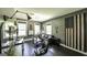 Inviting living room with many windows, gray walls, dark floors, and an American Flag at 5133 Woodmond Dr, Villa Rica, GA 30180