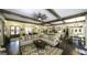Spacious living room open to the kitchen, complete with dark wood floors and comfortable seating at 5133 Woodmond Dr, Villa Rica, GA 30180