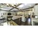 Open concept living space showcases a kitchen, dining, and living room combination, with dark wood floors at 5133 Woodmond Dr, Villa Rica, GA 30180