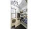 Organized pantry features shelving, storage baskets and a window for natural light, creating functional space at 5133 Woodmond Dr, Villa Rica, GA 30180