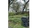 View of the wooded backyard area showing mature trees and potential for landscaping at 250 Mathewson Sw Pl, Atlanta, GA 30314