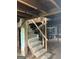 Basement stairs leading to a unfinished basement with concrete foundation and utility access at 250 Mathewson Sw Pl, Atlanta, GA 30314