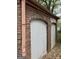 Garage area showing weathered brick and archways over doors needing rehab at 250 Mathewson Sw Pl, Atlanta, GA 30314