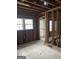 Showing the studs and framing in a vintage house undergoing renovations with tile floors at 250 Mathewson Sw Pl, Atlanta, GA 30314