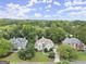 An aerial view of a suburban home with a landscaped front yard and mature trees at 3328 Sulky Se Cir, Marietta, GA 30067