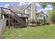 A wooden deck overlooks a yard with a wooden fence, promising peaceful enjoyment at 3328 Sulky Se Cir, Marietta, GA 30067