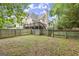 A spacious fenced-in yard with a wooden deck that offers a private outdoor space at 3328 Sulky Se Cir, Marietta, GA 30067