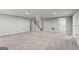 Expansive basement area with neutral carpet and staircase, perfect for a recreation or living space at 3328 Sulky Se Cir, Marietta, GA 30067