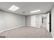 Finished basement featuring neutral carpet, a closet door and a hallway with easy access to other areas at 3328 Sulky Se Cir, Marietta, GA 30067