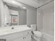 Clean bathroom with large mirror, tiled shower and tub, and neutral gray walls at 3328 Sulky Se Cir, Marietta, GA 30067