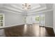 A well-lit bedroom featuring a trey ceiling, dark hardwood floors, and natural light at 3328 Sulky Se Cir, Marietta, GA 30067