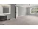 Bedroom featuring neutral carpet, natural lighting, a lighted vanity, and a ceiling fan at 3328 Sulky Se Cir, Marietta, GA 30067