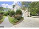 Side exterior of home, showing a paved walkway to the driveway and an attached garage at 3328 Sulky Se Cir, Marietta, GA 30067