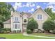 Charming home featuring a manicured lawn and mature landscaping at 3328 Sulky Se Cir, Marietta, GA 30067