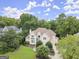 Stunning aerial view of home featuring lush, mature landscaping and a beautiful lawn at 3328 Sulky Se Cir, Marietta, GA 30067