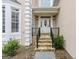 Charming front entrance with stone steps and a decorative front door with glass design at 3328 Sulky Se Cir, Marietta, GA 30067
