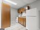 Functional kitchen with wooden cabinets, white appliances, and a neutral color scheme at 3328 Sulky Se Cir, Marietta, GA 30067