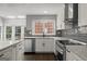 This remodeled kitchen features granite countertops, stainless steel appliances, and modern fixtures at 3328 Sulky Se Cir, Marietta, GA 30067