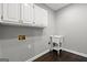 Functional laundry room with cabinets, sink, and connections for laundry appliances at 3328 Sulky Se Cir, Marietta, GA 30067