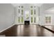 Spacious living room featuring a fireplace, hardwood floors, and abundant natural light at 3328 Sulky Se Cir, Marietta, GA 30067