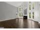 Bright living room with hardwood floors, tall windows, fireplace, and vaulted ceiling at 3328 Sulky Se Cir, Marietta, GA 30067
