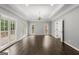 Spacious and bright living room featuring crown molding, hardwood floors, and large windows at 3328 Sulky Se Cir, Marietta, GA 30067