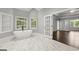 Main bathroom with a standalone tub and an entryway into another room at 3328 Sulky Se Cir, Marietta, GA 30067