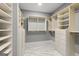 Walk-in closet with custom shelving and drawers to maximize storage at 3328 Sulky Se Cir, Marietta, GA 30067