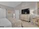 Cozy bedroom featuring neutral tones, a TV on dresser, and an inviting sitting area at 11 Frances Turn, Sharpsburg, GA 30277