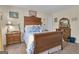 Classic bedroom with wood furniture, a cozy bed, and traditional decor at 11 Frances Turn, Sharpsburg, GA 30277