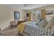 Bright bedroom showcases a cozy bed, natural light, and comfortable sitting area at 11 Frances Turn, Sharpsburg, GA 30277