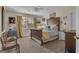 Charming bedroom with wood furnishings, natural light, and a comfortable bed at 11 Frances Turn, Sharpsburg, GA 30277