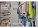Functional walk-in closet with plenty of storage space for shoes, bags, and hanging clothes at 11 Frances Turn, Sharpsburg, GA 30277
