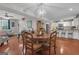 Open concept dining room with hardwood floors and a view of the kitchen at 11 Frances Turn, Sharpsburg, GA 30277
