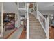 Grand foyer featuring a staircase, hardwood floors, and a view into other living spaces at 11 Frances Turn, Sharpsburg, GA 30277