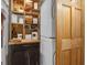 Charming laundry area with stacked washer/dryer and decoratively organized shelving at 11 Frances Turn, Sharpsburg, GA 30277